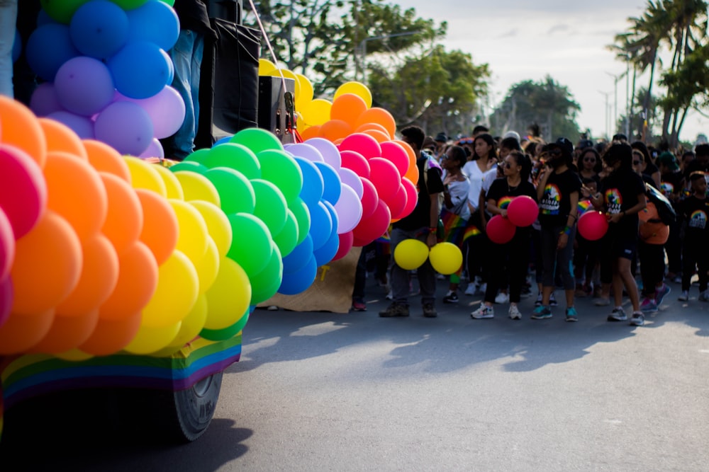 a group of people standing in front of a truck