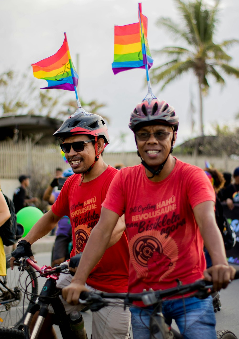 a group of people riding bikes down a street