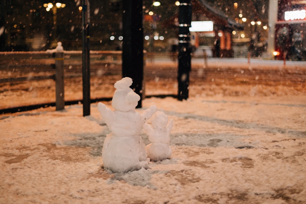 a snowman that is standing in the snow