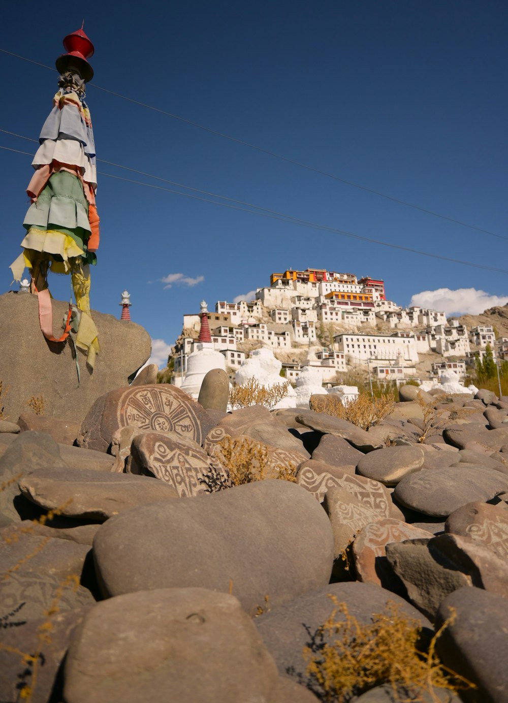 a rock garden with a statue of a woman on top of it