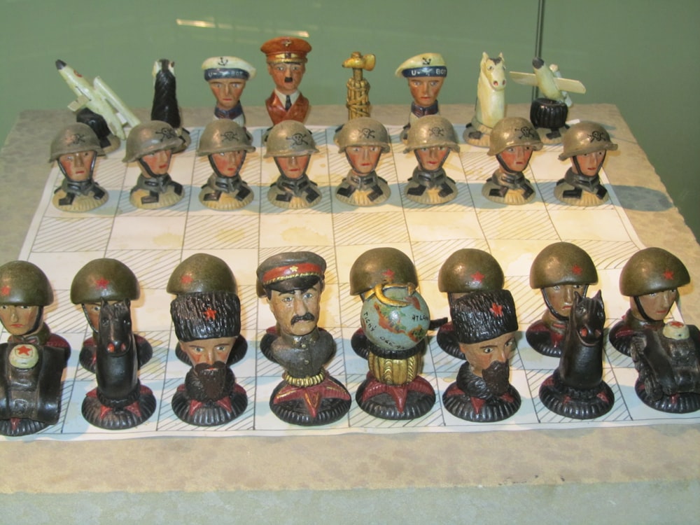 a chess board with a bunch of helmets on it