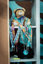 a teddy bear wearing a hat and scarf