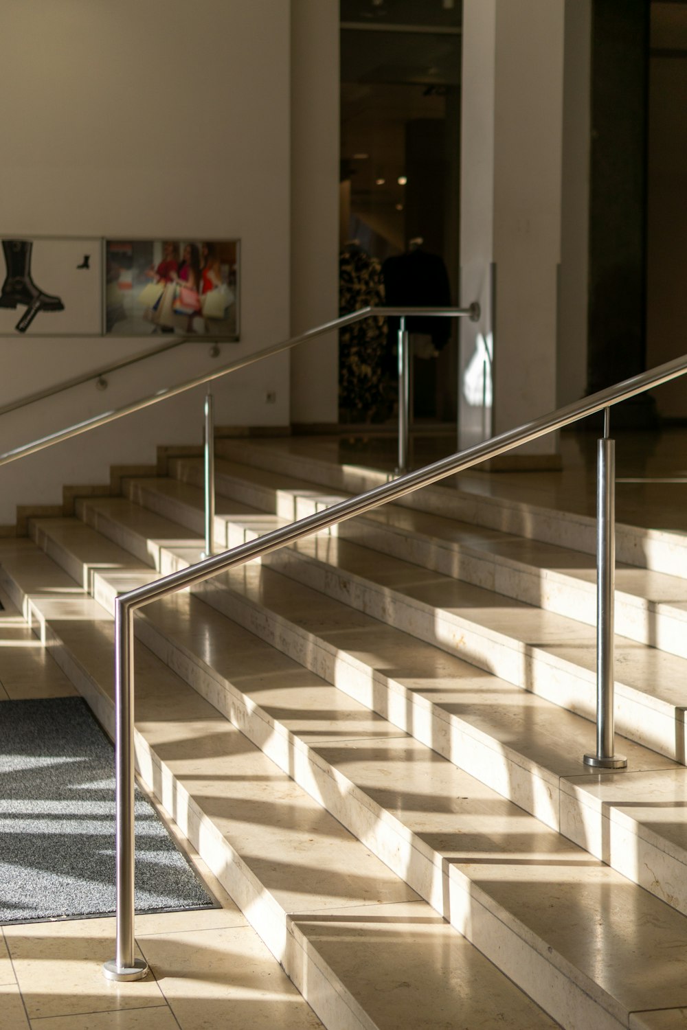 a man riding a skateboard down a metal hand rail