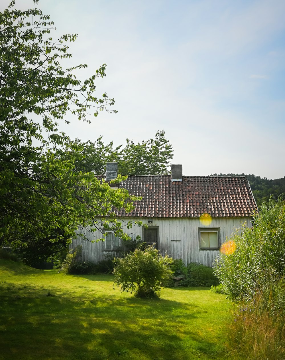 a white house with a red tiled roof