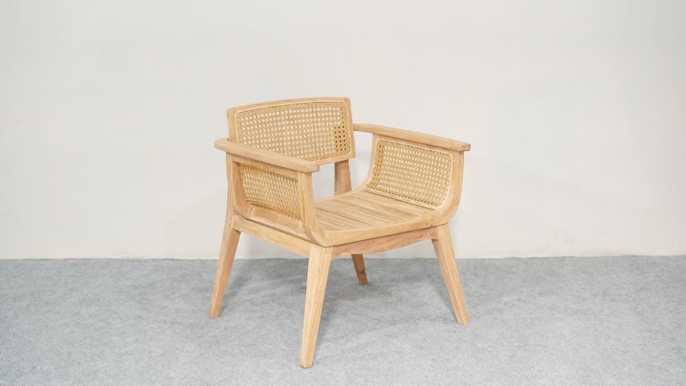 a wooden chair sitting on top of a carpeted floor