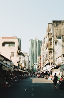 a person walking down a street in a city