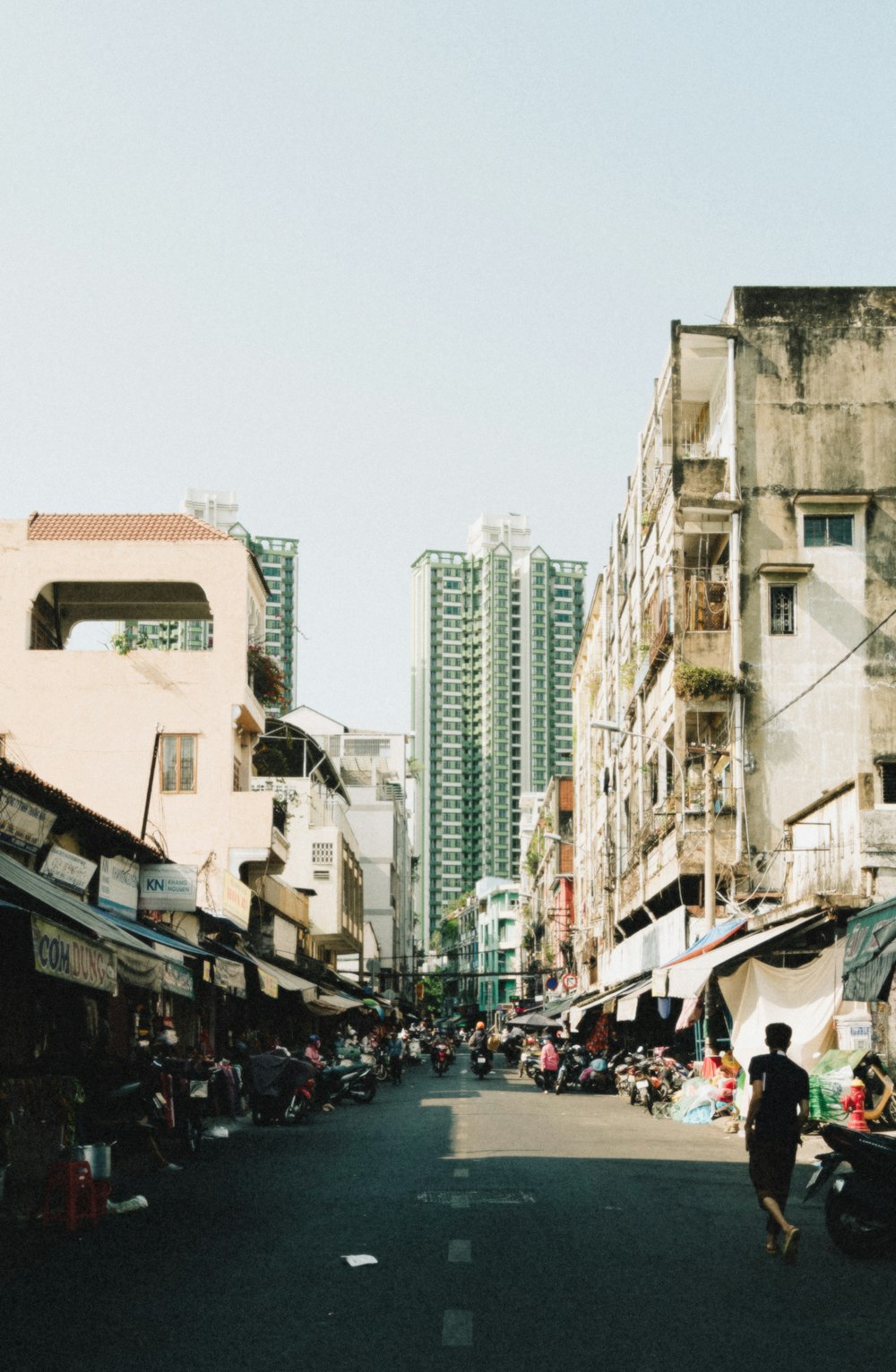 a person walking down a street in a city