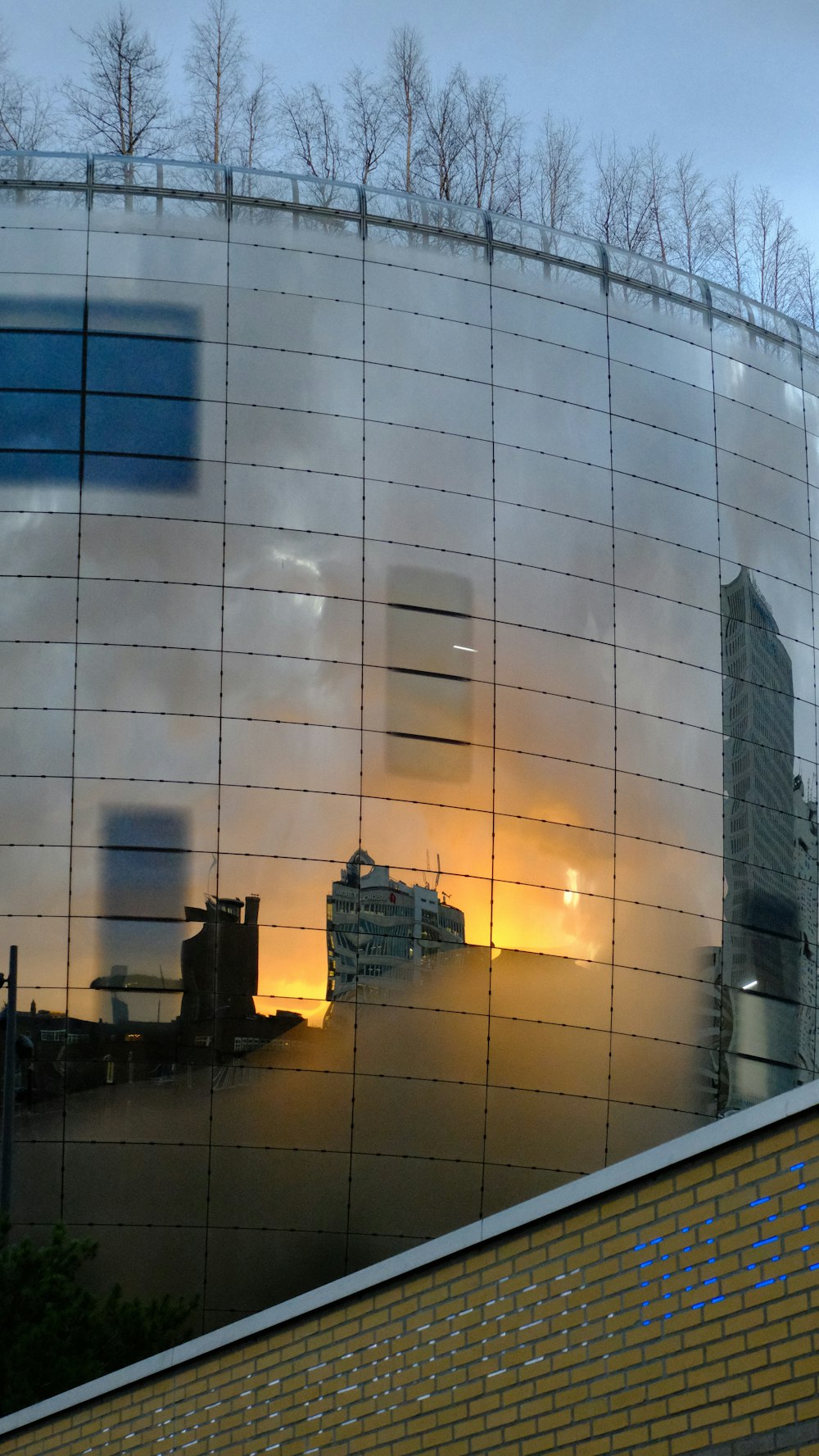 a reflection of a building in a window