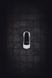 an overhead view of a car parked in a parking lot