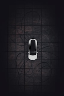 an overhead view of a car parked in a parking lot