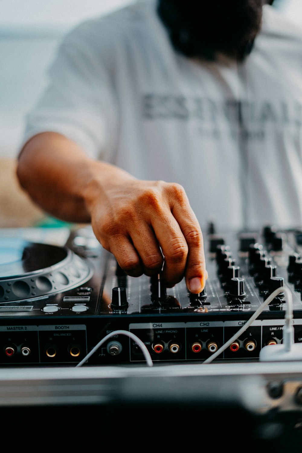a dj mixing a track on a turntable