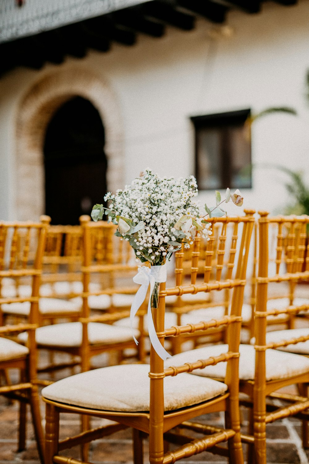 a bunch of chairs that have flowers on them