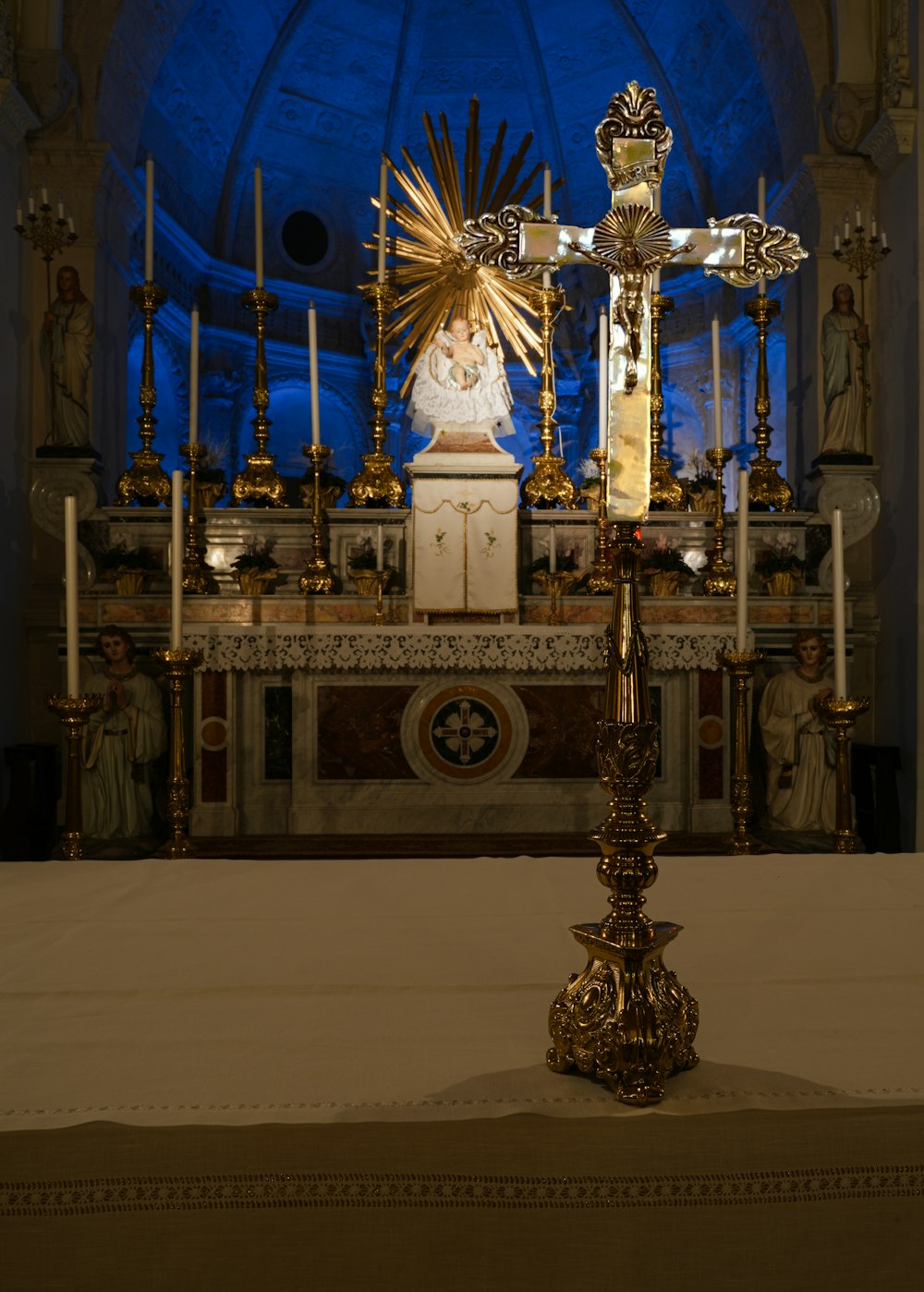 a statue of a person on a cross in a church