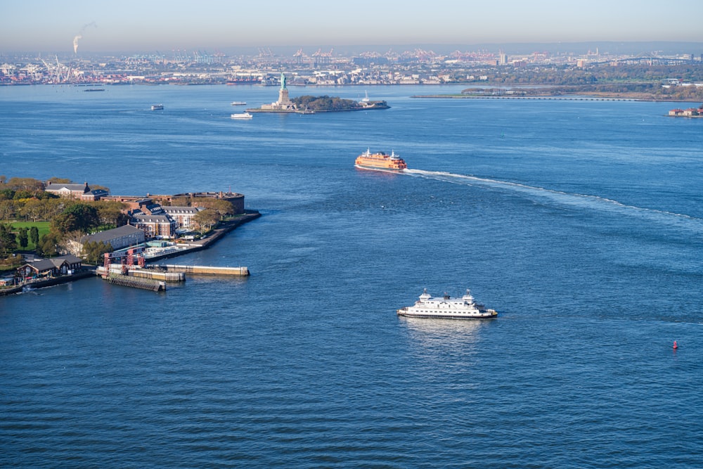 a boat traveling down a river next to a city