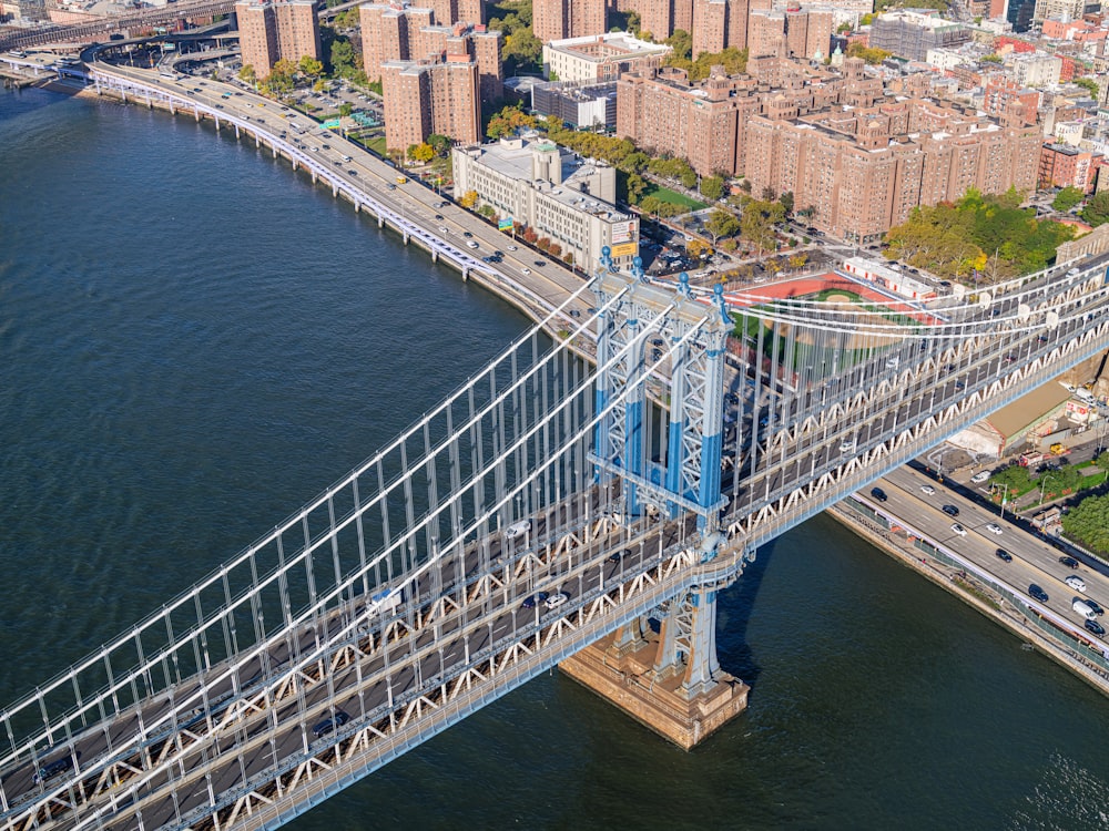 an aerial view of a bridge spanning the width of a city