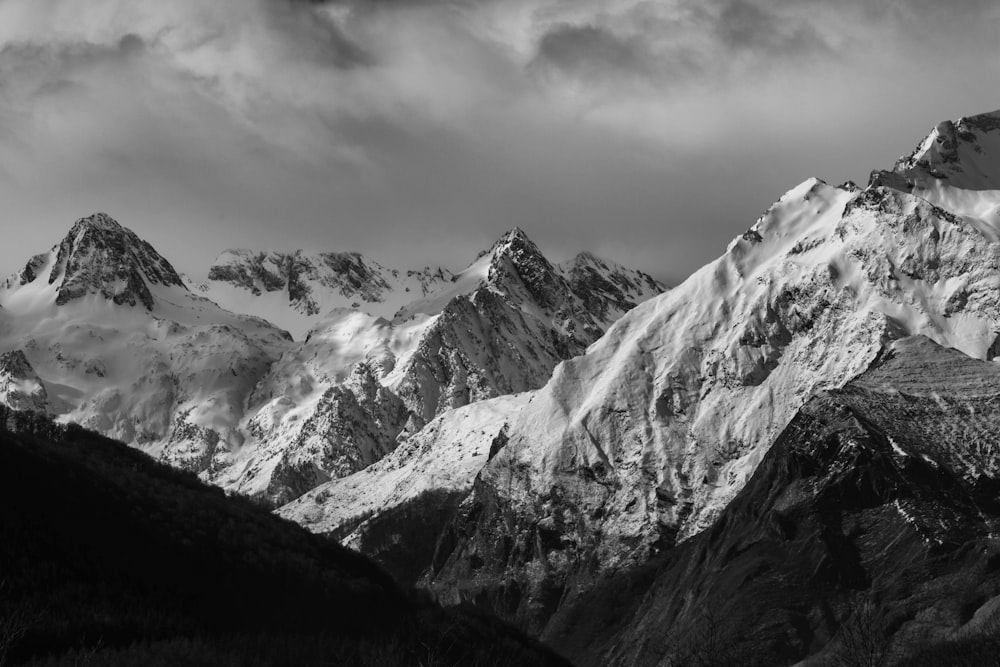 a black and white photo of a mountain range