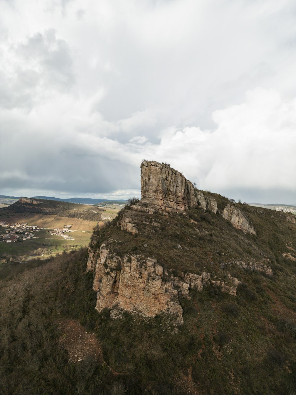 a rocky outcropping in the middle of a valley