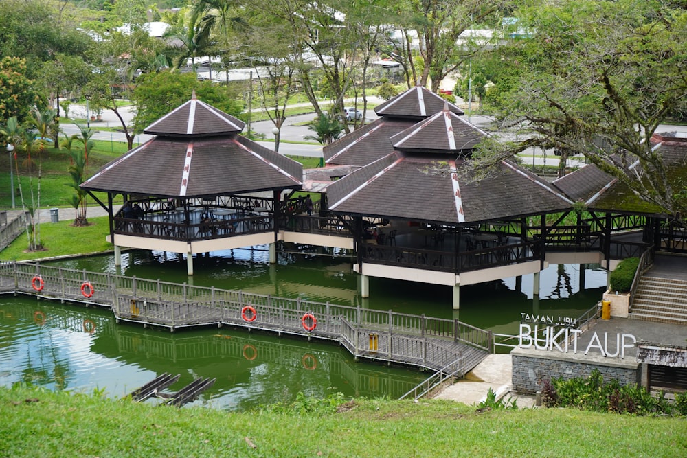 a group of pavilions sitting on top of a lush green field