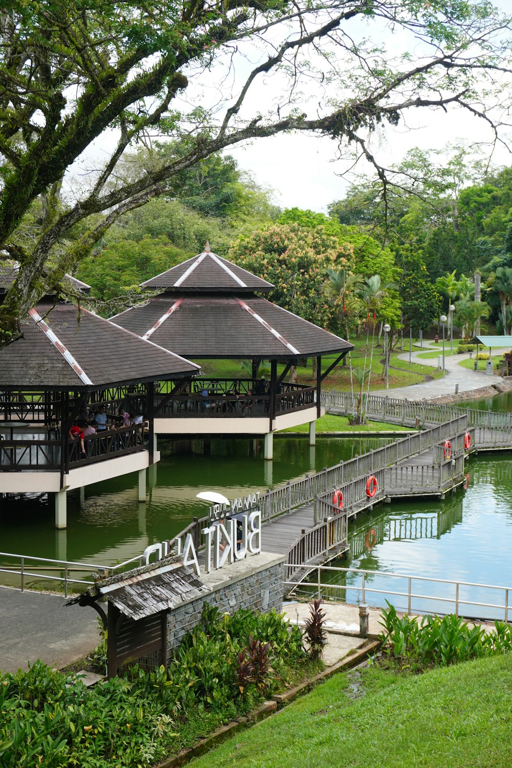 a park with several pavilions and a lake