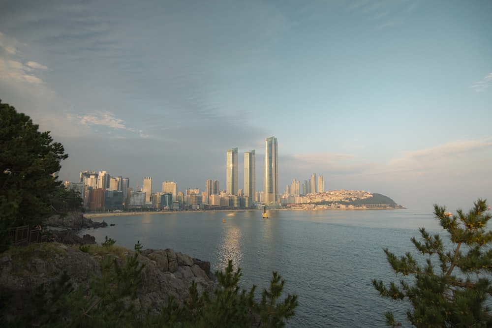 a large body of water with a city in the background