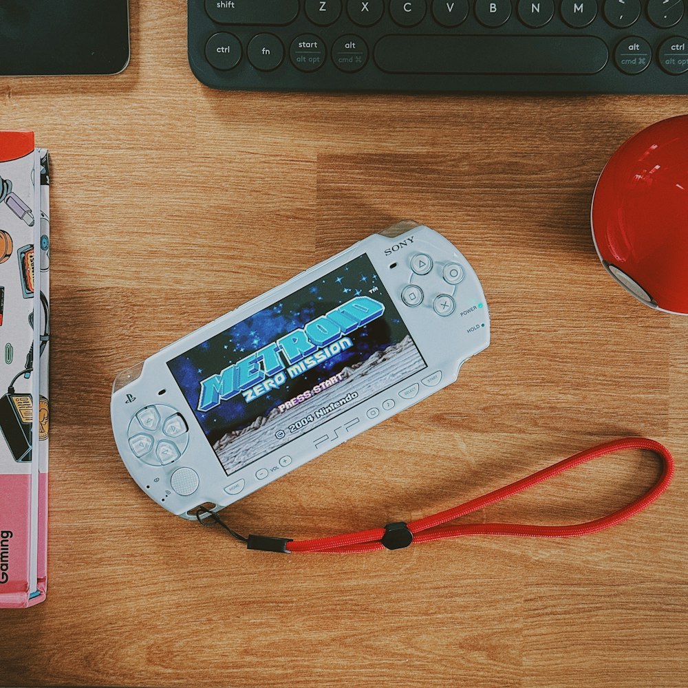 a nintendo wii game system sitting on top of a wooden table