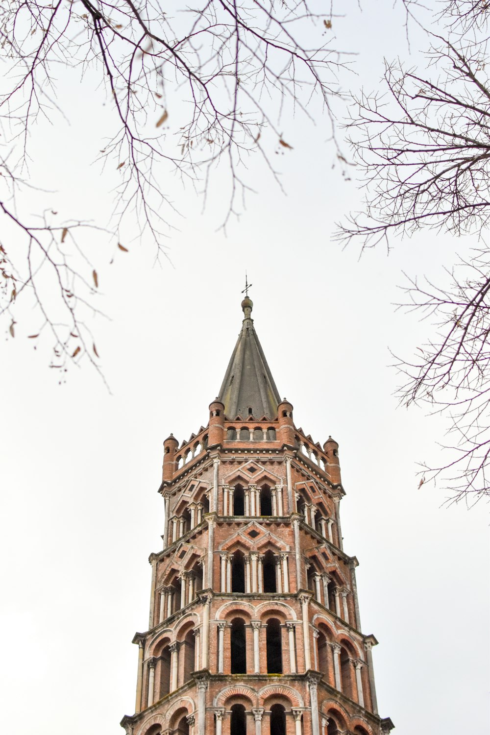 a tall tower with a clock on the top of it