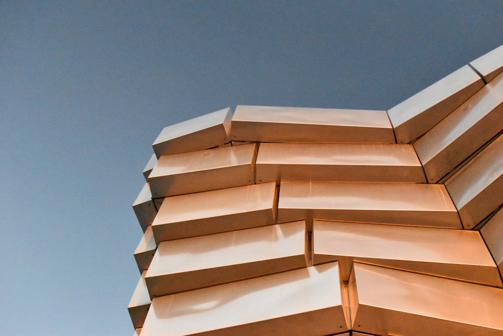 a close up of a building with a sky in the background