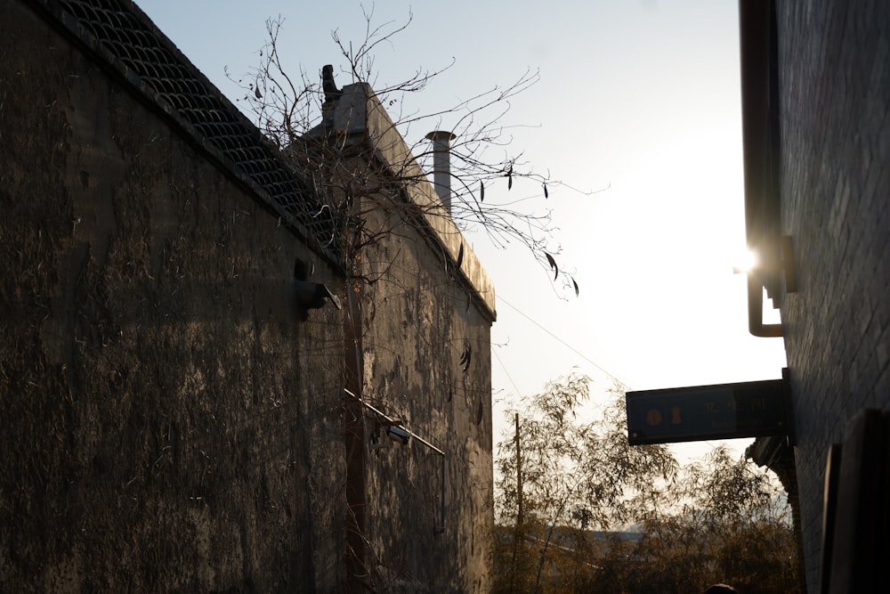 a person walking down a street next to a building