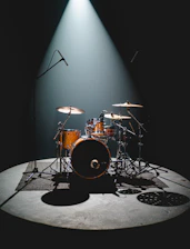 a drum set sitting on top of a stage