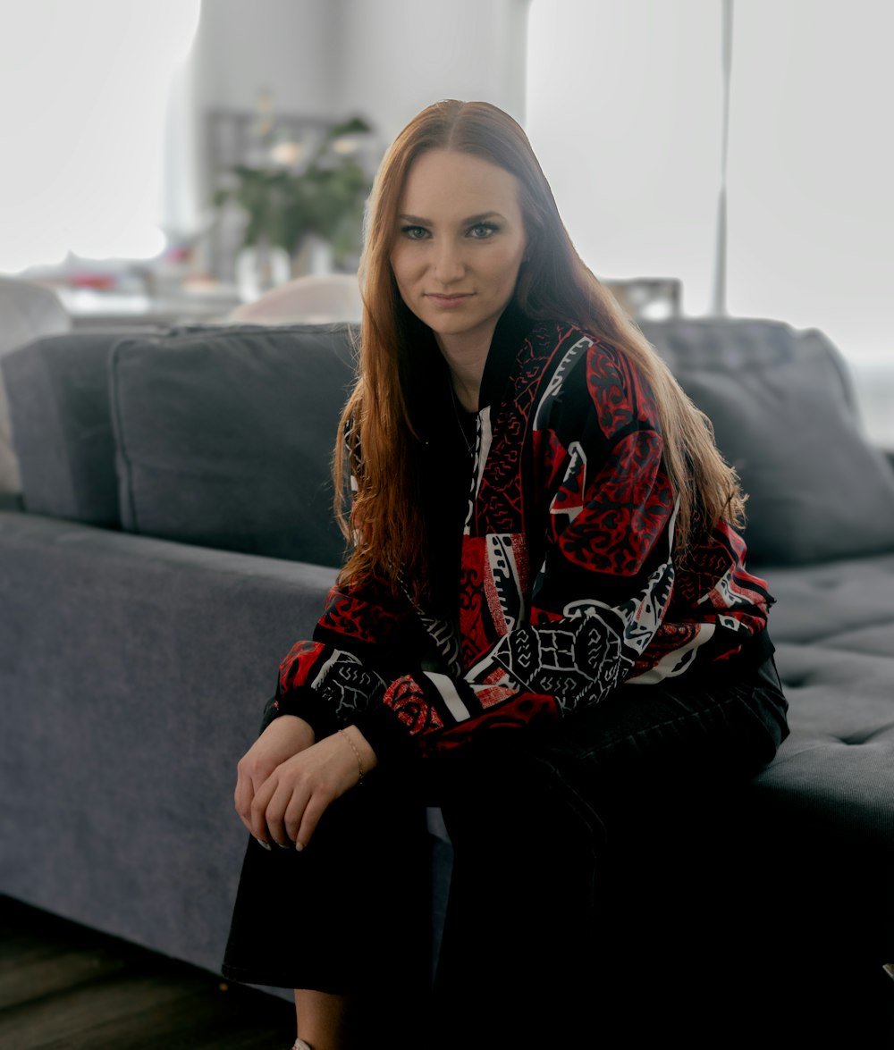 a woman sitting on a couch in a living room