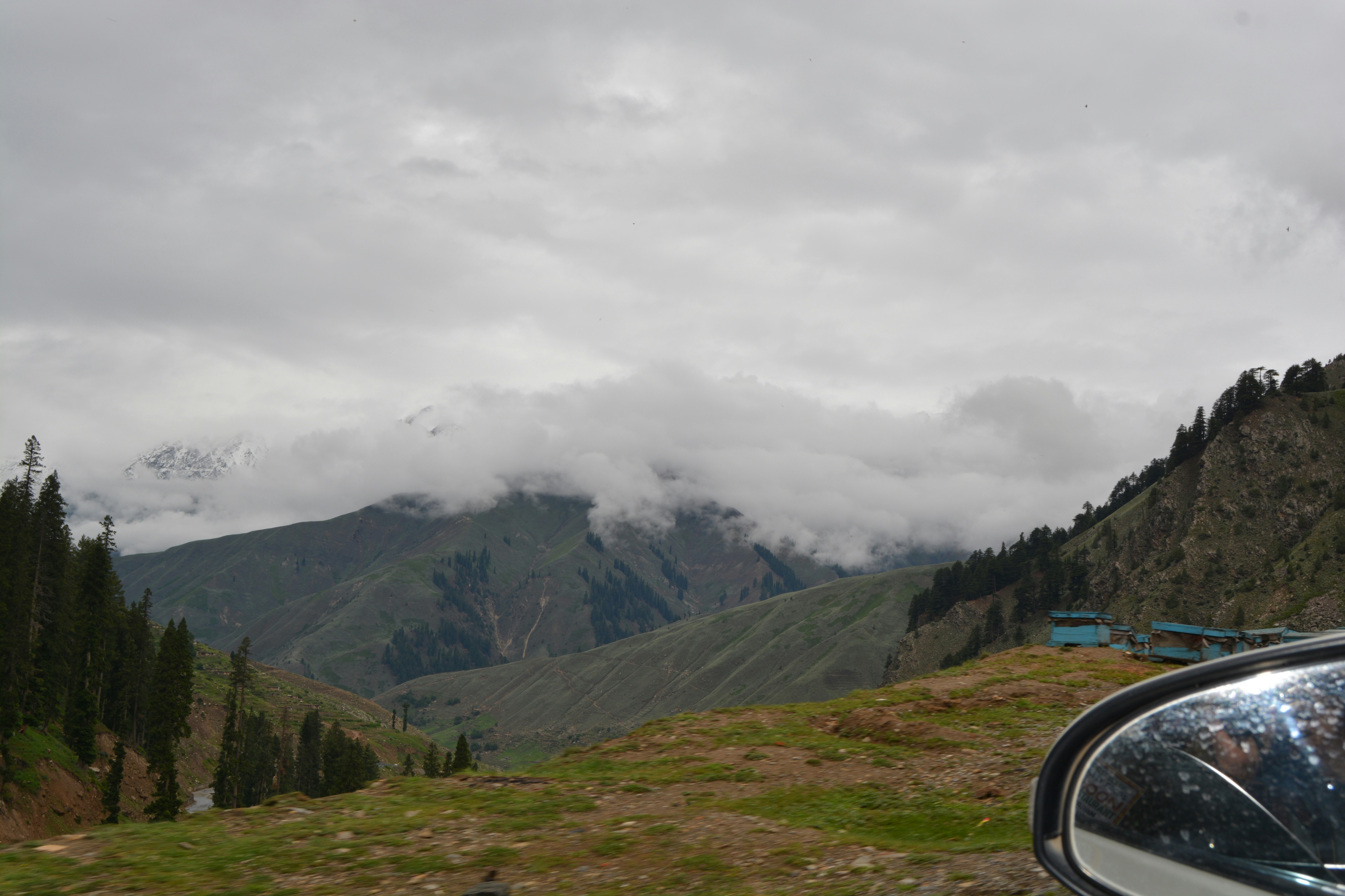 a view of a mountain range from a car window