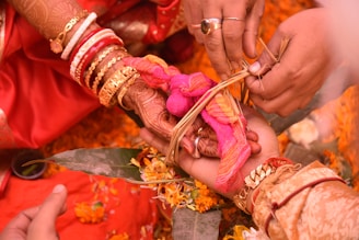 a close up of a person getting henna on another person's hand