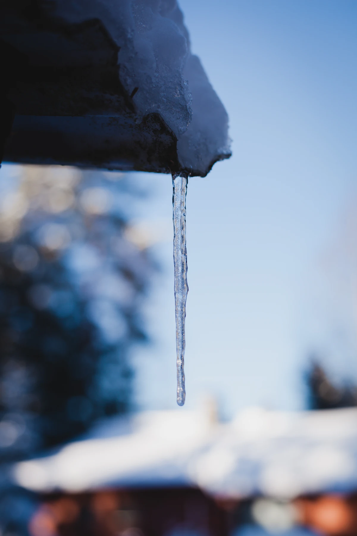 Icicle hanging from a house gutter