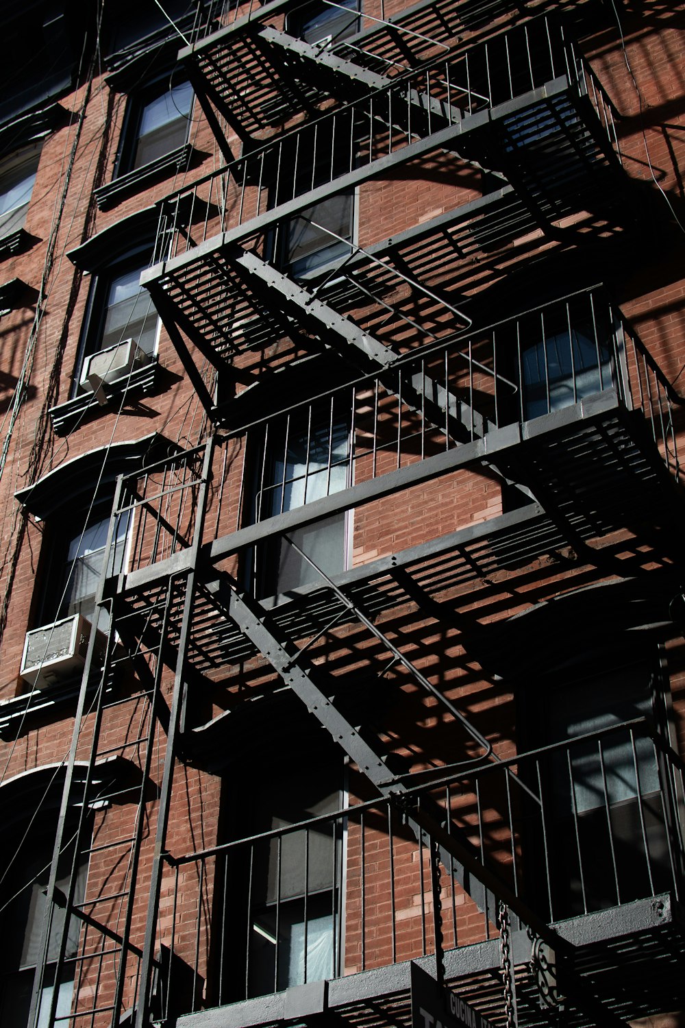 a fire escape on the side of a brick building