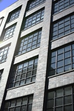 a tall brick building with lots of windows