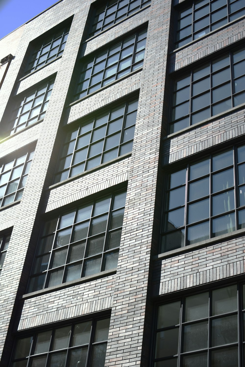 a tall brick building with lots of windows