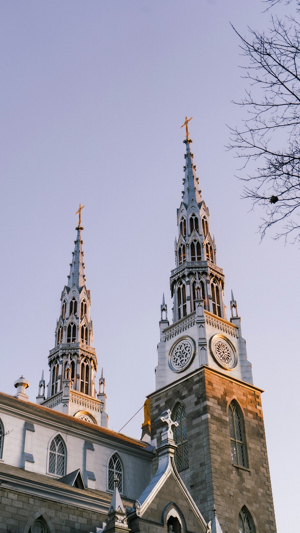 a church with two steeples and a clock tower