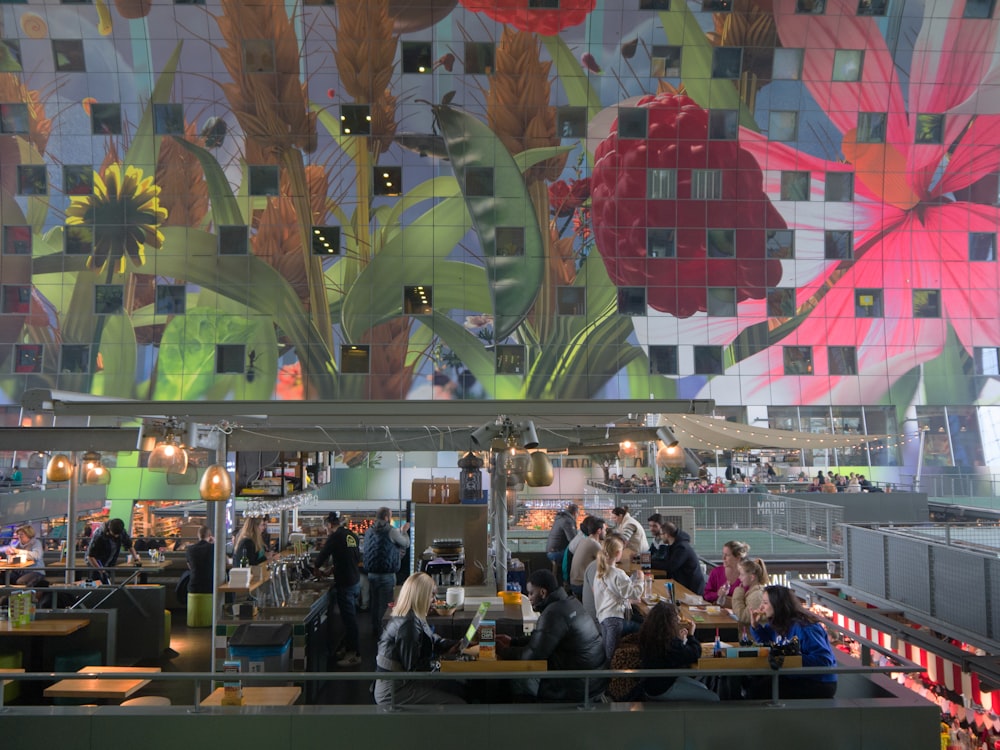 a group of people sitting at a table in a restaurant