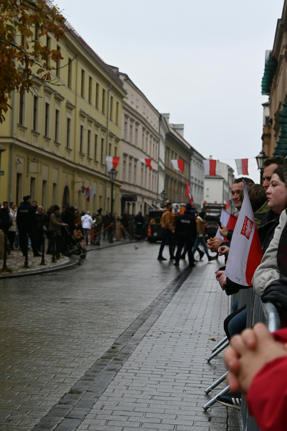 a group of people sitting next to each other on a sidewalk