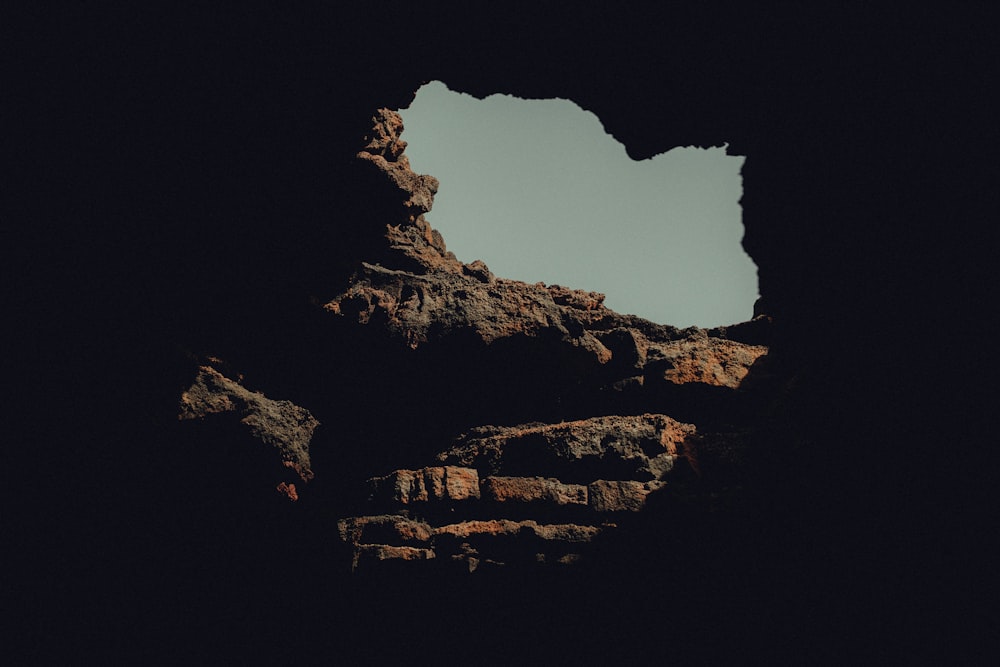 a rock formation with a sky in the background