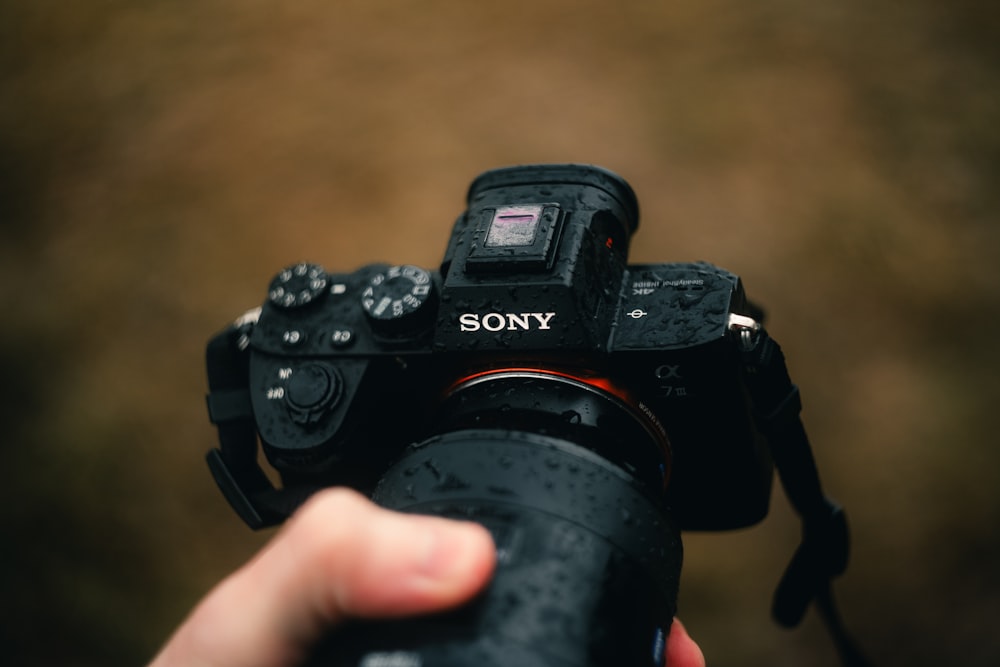 a person holding a camera up to take a picture