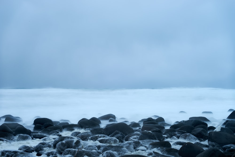 a large body of water surrounded by rocks