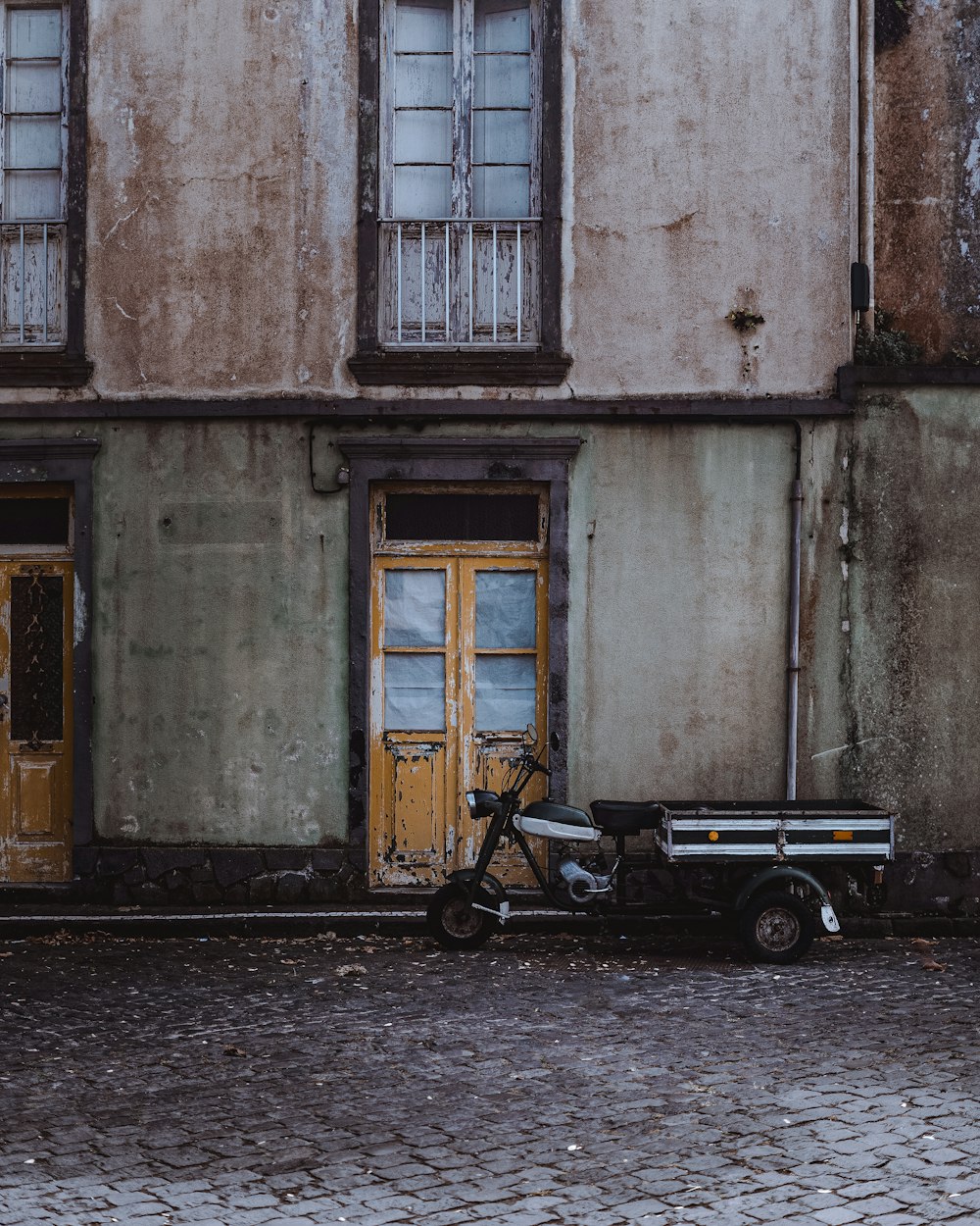 a motorcycle parked in front of a building