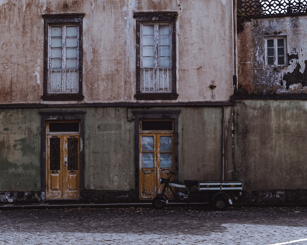 a motorcycle parked in front of a building