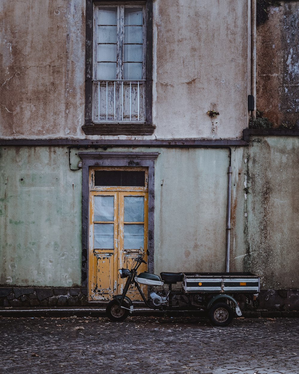 a motorcycle parked in front of a building