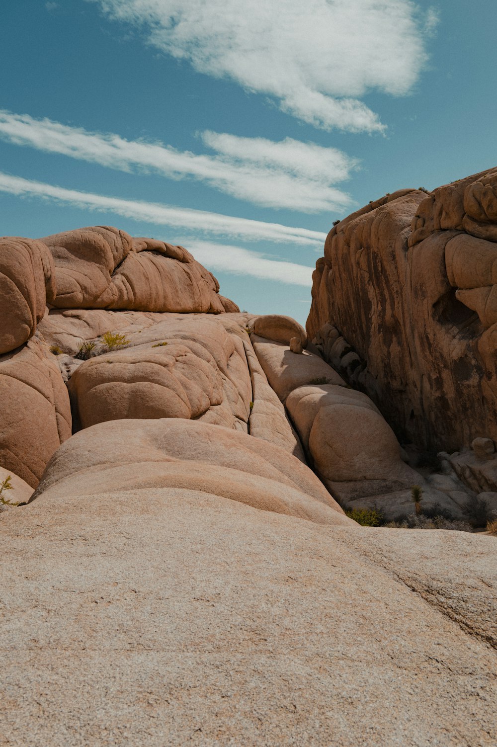 a rock formation in the desert under a blue sky