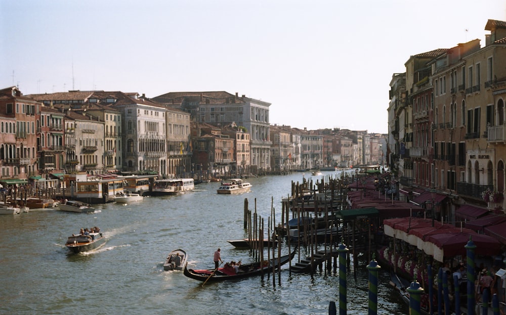 a waterway with boats and buildings on both sides