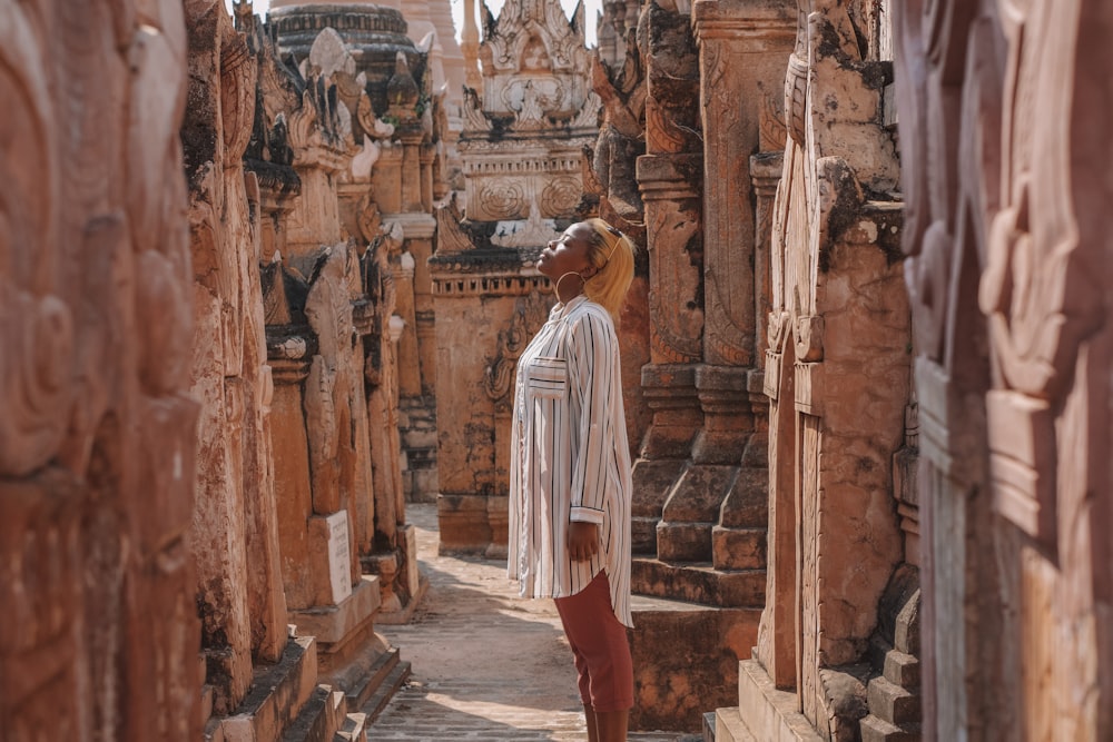 a woman standing in a doorway of a building