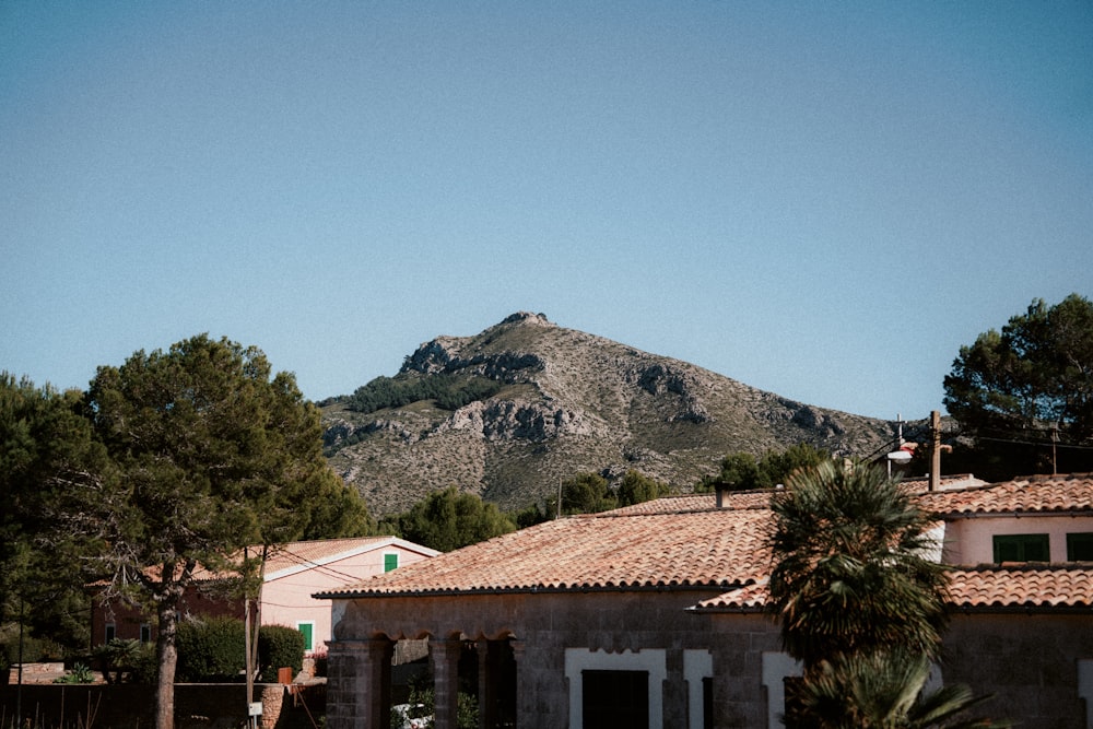 a house with a mountain in the background