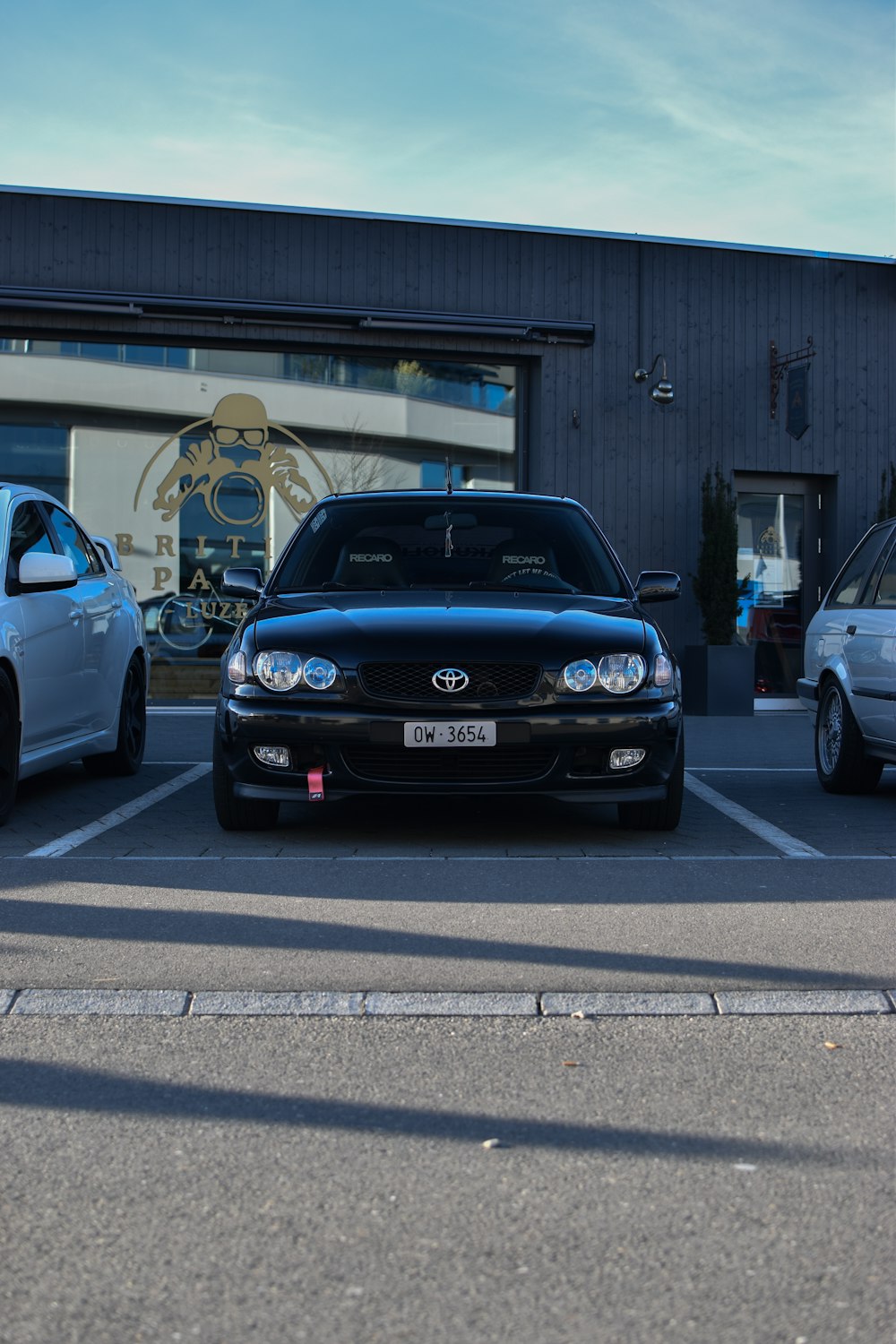 a couple of cars parked in a parking lot